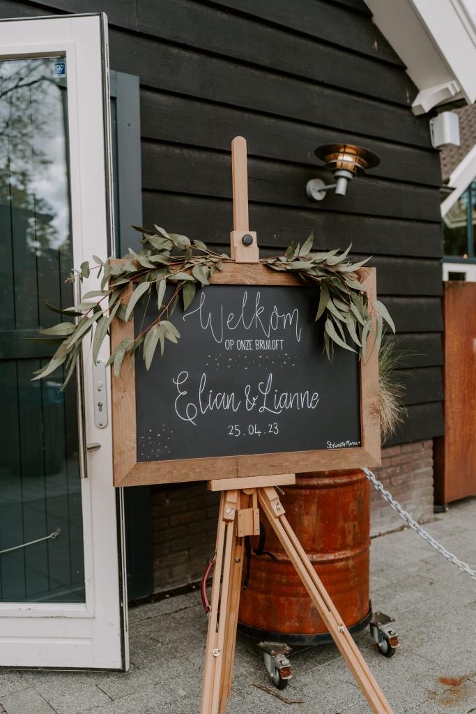 Welkomstbord met houten rand